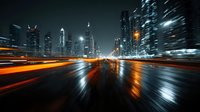 Urban night scene with motion blur light trails on wet city street surrounded by illuminated skyscrapers creating dynamic speed effect for modern design.
