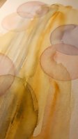 Abstract watercolor painting with flowing golden yellow and soft purple circular shapes creating organic movement and artistic expression.