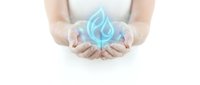 Female hands holding glowing water droplet symbol representing conservation, sustainability, environmental care, and eco-friendly solutions for business and wellness concepts.