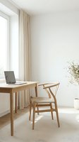 Minimalist home office workspace with wooden desk, laptop and chair in bright natural light interior for remote work and productivity.