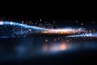 Magical glowing particles trail with blue and orange light effects on dark background, creating ethereal atmosphere for abstract design projects.