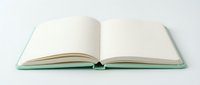 Open blank notebook with mint green cover and cream pages spread flat on white background, ready for writing, journaling, or creative projects.