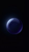 Glowing blue transparent sphere with luminous rim floating in dark space with subtle light reflections and cosmic atmosphere.