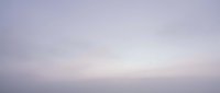 Serene dawn sky with soft purple and lavender tones blending into pale white, creating a tranquil, minimalist atmosphere suitable for backgrounds and design projects.