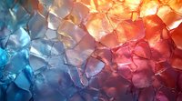 Colorful cracked ice texture with blue and orange gradient lighting creates dramatic abstract background pattern. Frozen water crystals catch light dramatically.