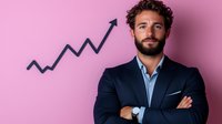 Confident businessman with beard wearing navy suit stands with crossed arms against pink wall, upward trending graph shows business growth and success.