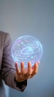 Businessman holding glowing holographic sphere with cloud computing network and data connections for digital transformation and technology solutions.