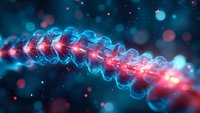 Glowing spiral DNA helix structure with red and blue illumination against dark background showing genetic research and molecular biology concept.