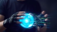 Young adult male wearing black gloves holding glowing blue digital sphere with data streams, representing technology, artificial intelligence, and innovation for digital transformation concepts.