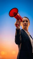 Professional businesswoman holding red megaphone against dramatic sunset sky for leadership and communication concepts in corporate marketing campaigns.