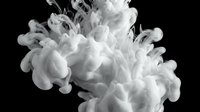 White ink or paint dissolving in water, creating dramatic smoke-like cloud swirls on a dark black background, monochrome abstract art.