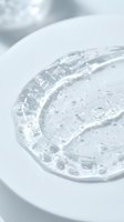 Clear gel serum with bubbles on white plate, skincare cosmetic product for beauty, dermatology, wellness and cosmetics industry applications.
