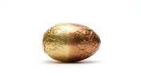 Golden Easter egg with ornate floral patterns isolated on white background for holiday decorations and seasonal design projects.