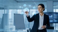 Professional businesswoman interacting with holographic cloud computing interface in modern office environment for digital transformation concepts.