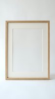 Empty wooden picture frame with white mat on neutral background for mockup and design projects.