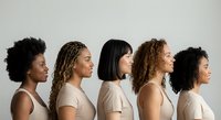 Diverse group of five women with different natural hairstyles in profile view wearing neutral clothing against light background for beauty concepts.