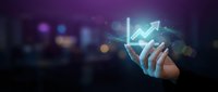Businessperson holding smartphone displaying glowing upward trending arrow graph, symbolizing financial growth, stock market success, and digital investment analytics for business applications.