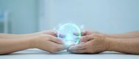 Two hands holding glowing digital globe with blue light effect, representing global connection, technology, and worldwide communication for business and innovation concepts.