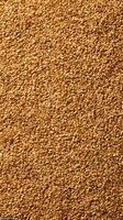 Golden sesame seeds texture background for healthy cooking and baking projects. Natural organic grain pattern for food industry and culinary designs.