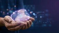 Hands holding glowing digital cloud with network connections representing cloud computing technology and data storage solutions for modern business.