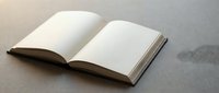 Open blank book with empty white pages on neutral background for writing, reading, education and literature projects.