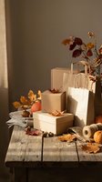 Autumn shopping bags and gift boxes arranged on rustic wooden table with fall leaves and warm sunlight for seasonal retail and holiday marketing.