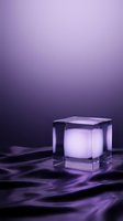 Glowing translucent cube with luminous core on rippled purple surface against gradient backdrop. Suitable for product display, tech presentations, and modern design concepts.