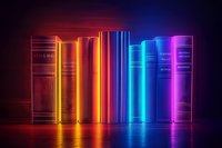 Row of glowing books in vibrant neon colors from orange to blue and purple standing on reflective surface against dark background, creating modern library concept.