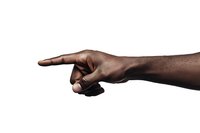 African American hand pointing right against white background, dramatic side lighting creates strong contrast and shadow detail, isolated for design use.
