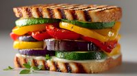 Grilled vegetable sandwich with colorful bell peppers, zucchini and eggplant on toasted bread, healthy vegetarian meal concept for restaurant menu design.