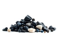 Pile of smooth black and white river stones and pebbles arranged on white background, isolated composition for spa, wellness and meditation designs.