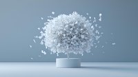 Explosive burst of white crystal fragments emerging from cylindrical platform against gray background, creating dynamic motion effect and dramatic visual impact.