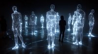 Glowing holographic human figures in dark space with silhouette walking among luminous digital avatars connected by light trails on reflective floor.