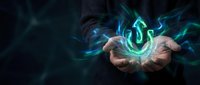 Businessman hands holding glowing digital energy sphere with flowing light effects on dark background for technology and innovation concepts.