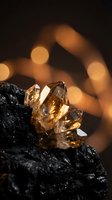 Golden citrine crystal cluster on dark volcanic rock with warm bokeh lights creating magical mineral specimen display for healing and meditation practices.