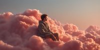 Young man sitting peacefully on fluffy pink clouds during golden hour sunset, dreamy surreal atmosphere for meditation and mindfulness concepts.