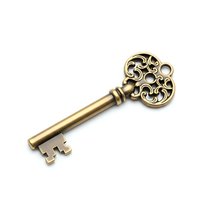 Ornate vintage brass key with decorative scrollwork head isolated on white background for antique design projects and security concepts.