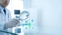 Male Asian doctor in white coat holding magnifying glass over glowing medical icons, healthcare research and diagnosis concept.