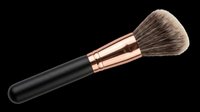 Makeup brush with black handle and rose gold ferrule featuring soft synthetic bristles, isolated on transparent background. Ready for beauty product design, cosmetics packaging, tutorials, and print-on-demand applications.