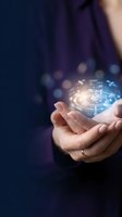 Businessman hands holding glowing digital technology icons and data connections on dark blue background for innovation and future concepts.