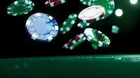 Poker chips falling on green felt table with dramatic lighting and bokeh effects, creating dynamic casino atmosphere. Focus on blue, green and red gaming tokens in motion.