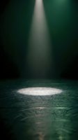 Dramatic spotlight beam illuminating empty stage floor with atmospheric lighting effects creating moody theatrical ambiance for performance presentations.