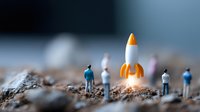 Miniature people observing glowing rocket on rough terrain, creative business concept with tiny figures and spacecraft launch, macro photography scene.