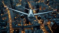 Commercial passenger aircraft flying over illuminated city at night with glowing streets below, front view of plane with landing lights against dark urban landscape.