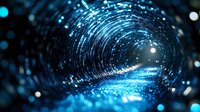 Glowing blue tunnel with light particles and bokeh effects creating futuristic digital wormhole visualization against dark background. Concept of quantum technology.