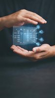 Hands protecting holographic digital network diagram with glowing connections and data flow visualization for cybersecurity and technology concepts.