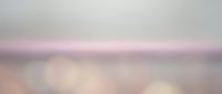 Soft pastel sunrise or sunset sky with gentle pink, purple, and white cloud formations creating a serene, dreamy atmosphere for backgrounds and overlays.