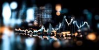 Financial market data visualization with glowing stock charts and trading graphs against dark blurred cityscape background, showing market volatility and analysis.