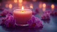 Glowing pink scented candle in glass holder surrounded by purple orchid flowers against blurred bokeh background creates romantic spa atmosphere.