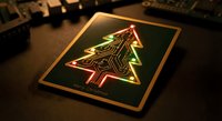 Electronic circuit board Christmas tree design glowing on tablet screen for holiday tech greeting cards and seasonal digital marketing campaigns.